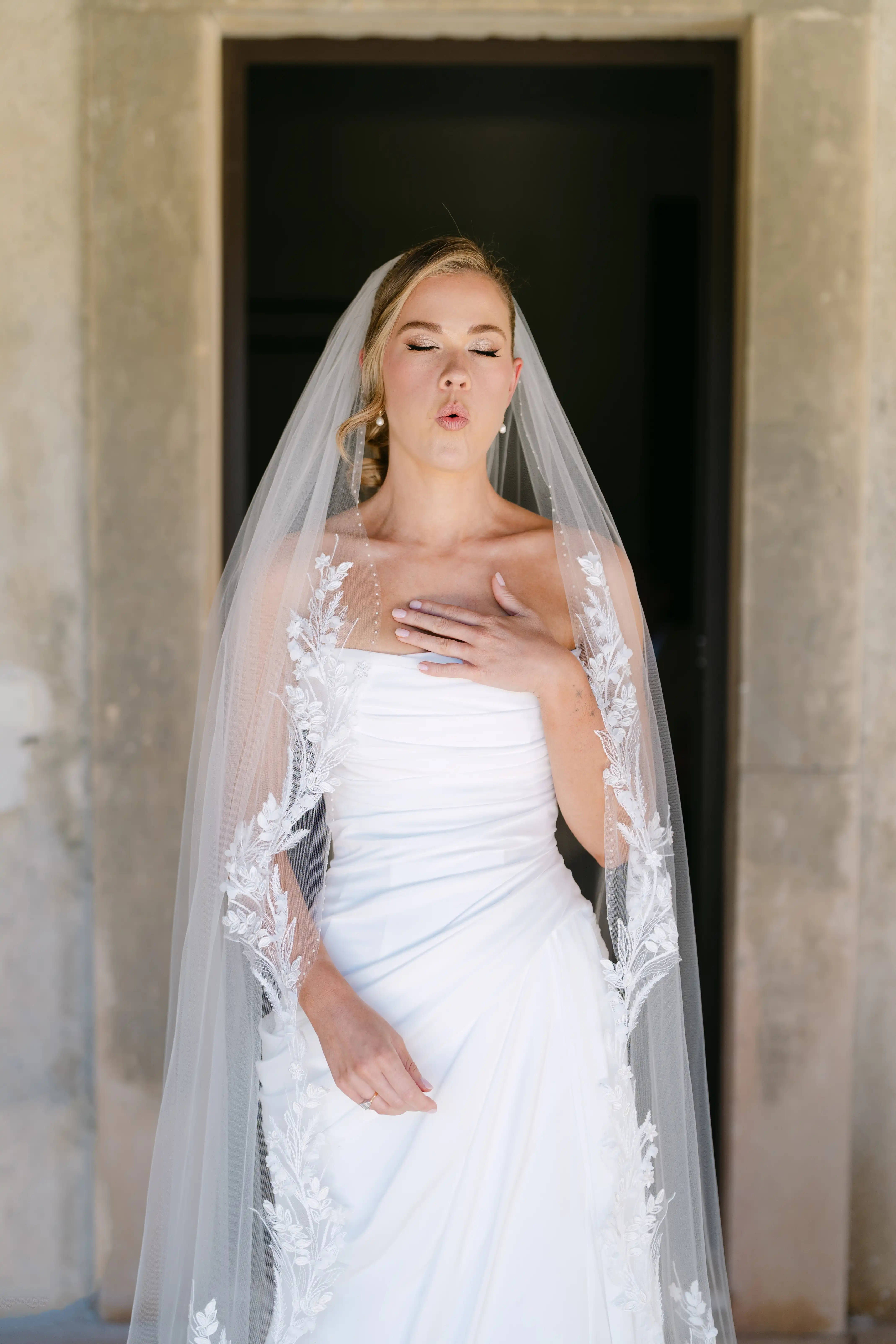 Elegant bride portrait with lace veil during luxury destination wedding in Italy